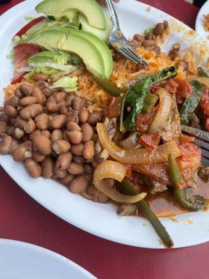 Bistec a la mexicana with jalapeños, onions, & tomato sauce.