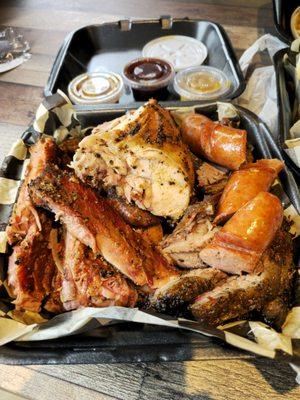 Half Smoked Chicken, Sliced brisket from point and flat, 4 amazingly delicious ribs, and a link sausage.