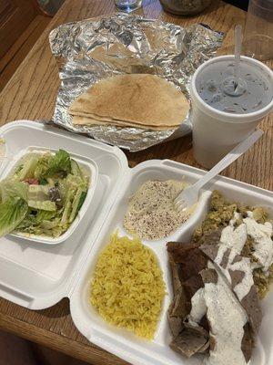 Gyro combo meal. Lamb, chicken, rice, hummus, pita, pop, salad.