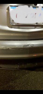 Damage to the paint and bottom piece from being rear ended.