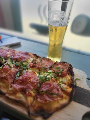 Pinsa La Margheritta ($17), add salami ($2), with Peroni ($5)