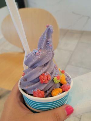 Taro soft serve ice cream with two toppings (trix cereal & cotton candy bits)