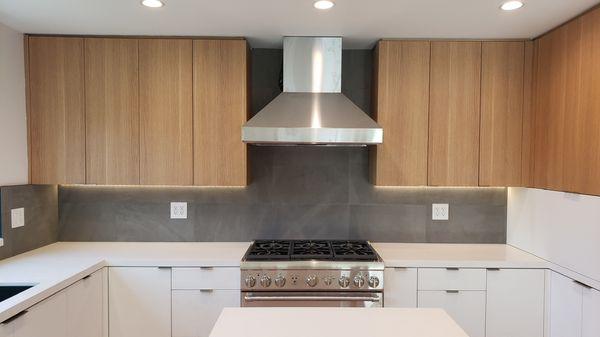 Flat panel oak custom cabinetry.