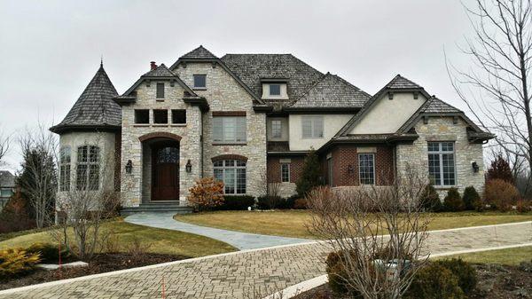 The right gutter installation will keep this home and yard in great condition.