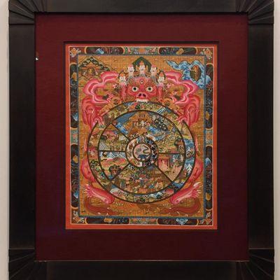 This beautiful Mandala is framed with a hand carved, hand finished frame and a fabric mat with museum glass.