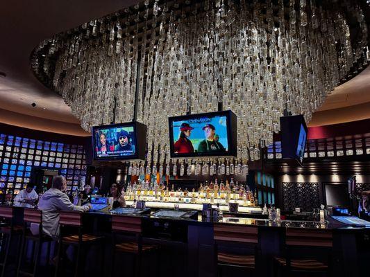 Chandelier is made from tequila bottles.