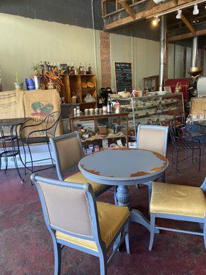 Indoor seating with pastry case in the back