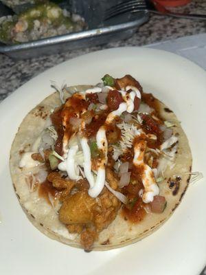 Fish taco with hot sauce