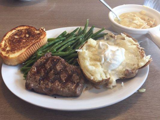 6 oz steak with baked potato.