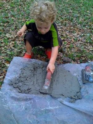 Little helper smooths the cement