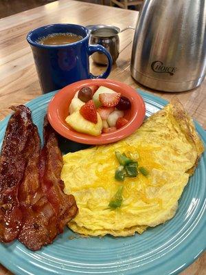 Western with fruit and a side of extra crispy bacon.  Very good coffee!!