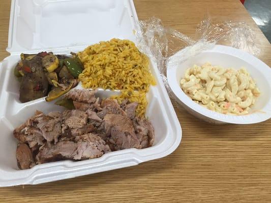 Pork , veggies and rice.  "Small" side of macaroni salad.   Great food at even better prices.