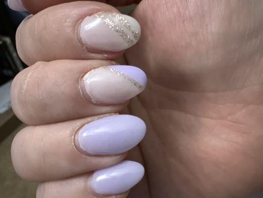 Not a single nail is the same shape. Sloppy edges along cuticle.