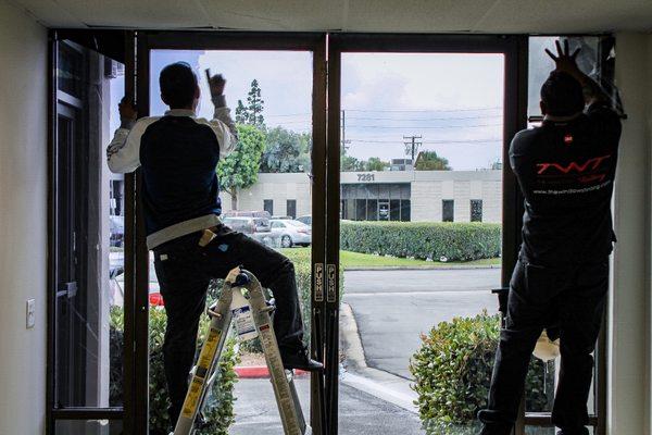 Removal and re-tint of a store front.