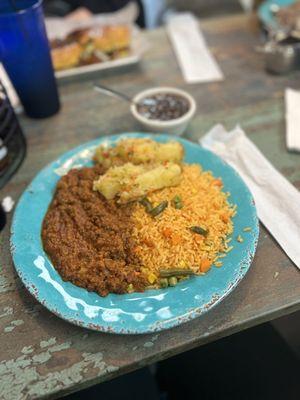 Picadillo, yellow rice, black beans and garlic yuca