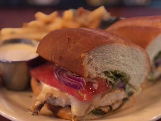 Pesto chicken sandwich with garlic fries