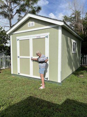 My mom.  She was excited to get the new Tuff Shed.  A 10x16.