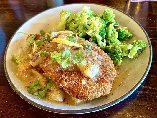 Huge Tilapia Filet with a wonderful lemon butter drizzle on a bed of diced potatoes and steamed broccoli, WOW!