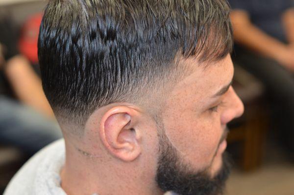 Taper fade with beard trim.