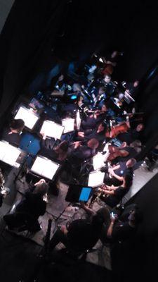 orchestra in sunken area in front of stage