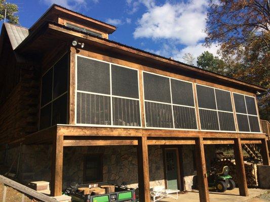 A gorgeous vacation mountain home's porch that Breeze Thru Screens rescreened with Tuff Screen.