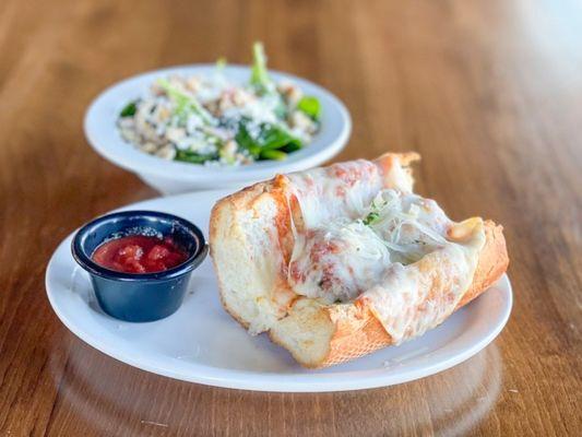 Meatball Sub with a spinach salad. One of the options on our 2 for $12 lunch specials - served Monday - Friday 11-2.