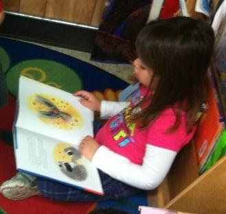 Children enjoy our EAC library during scheduled reading time.