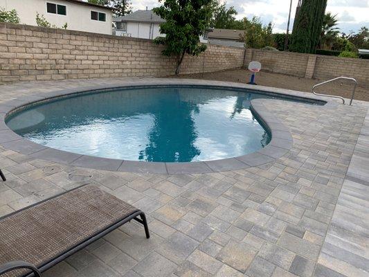 renovated pool with micro-pebbletech surface that doesn't hurt little kids feet. and our new decking