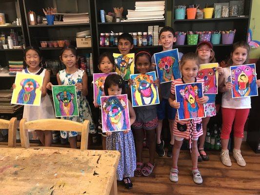 Monday 6-8 year old art class displaying their Dog pictures!