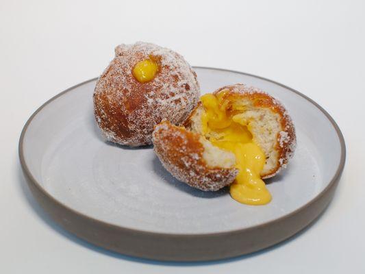 Malasadas with passionfruit curd