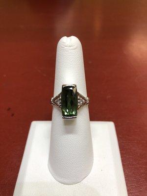 hand made 14k white gold ring with deep green tourmaline and diamonds.