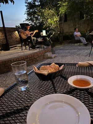 Complimentary bread and dipping oil. Delish!!! Live music as well on the courtyard. 10/10