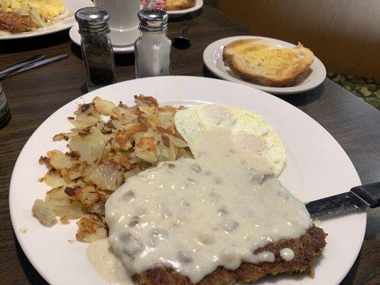 Chicken fried steak and egg breakfast