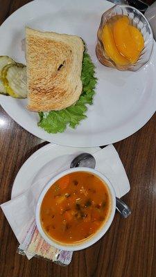 Albondigas soup, turkey half sandwich and peaches