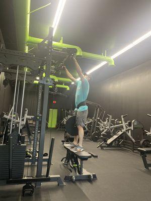 Pull-ups with a 45-pound plate.