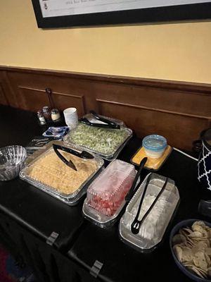 You can bring food into the venue, setting up the taco bar