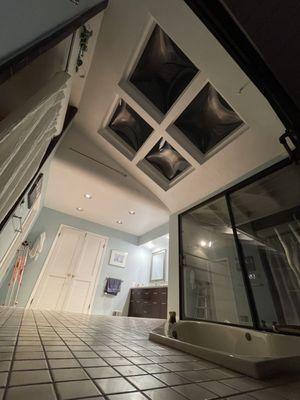 "Drywall finishing around a new skylight installation to create a clean and modern look."