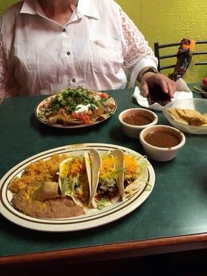 Nacho appetizer and 3 taco combo plate.