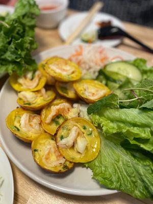 Mini turmeric pancakes. Amazing batter (it's the banh xeo batter). No where else in the city serves this dish (as far as I know).