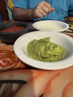 Salsa, guacamole and white queso. Chips not pictured