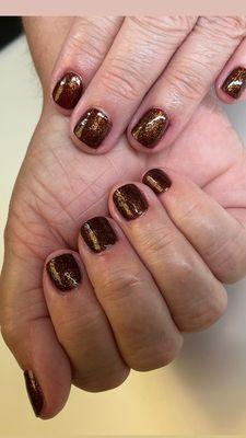 Shimmery bronze with deep red undertones. Another fall color. By Kiarasky Frosted  pomegranate.