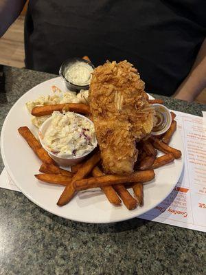 Half potato chip crusted fish fry with sweet potato fries and pasta salad and coleslaw.