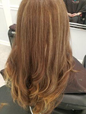 bringing her hair back to life with color correction, highlights, and haircut. The smallest details make an impact.