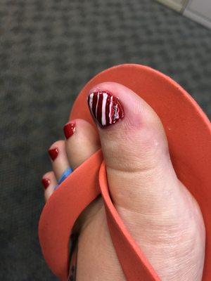 Extremely messy paint application of a candy cane designed on my big toe.