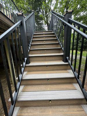 Trex steps with toasted sand and rocky harbor.