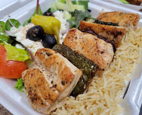 Chicken kabob with rice and Greek salad