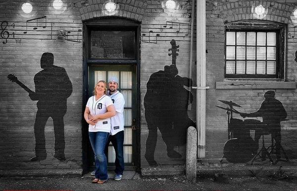 For this engagement session we found a mural on a back alleyway in north Lansing with silhouetted musicians...