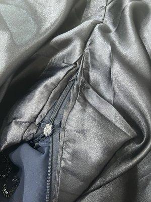 This is the inside where she sewed over the zipper