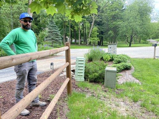 Person on left is a PIALA employee. On right is neighbor's property that they have planted bushes on. The PIALA's employee is on left.