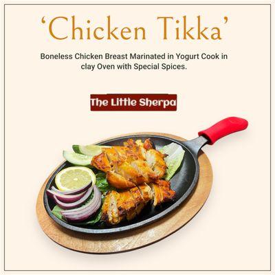 Boneless Chicken Breast Marinated in Yogurt Cook in clay Oven with Special Spices.